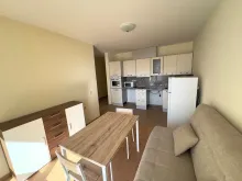 Crown Fort Club | Двухкомнатная квартира: гостиная, кухня